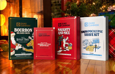 Holiday Gift Set Books next to a christmas tree and a lit fire.