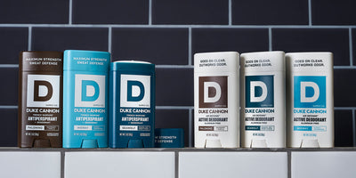 Six new deodorants from Duke Cannon. Antiperspirant deodorants are on the left and aluminum free deodorants are on the right. All products featured on a countertop.