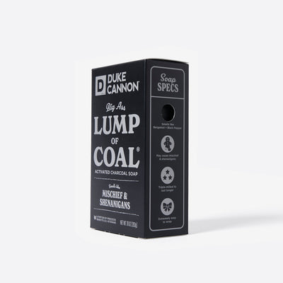 Big Ass Brick of soap inside of its packaging with 'Duke Cannon' branding on a white background. Big Ass Lump of Coal. With the soap specs on the side.