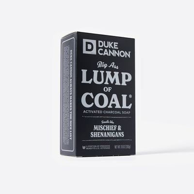 Big Ass Brick of soap inside of its packaging with 'Duke Cannon' branding on a white background. Big Ass Lump of Coal. With creative product description on the side.