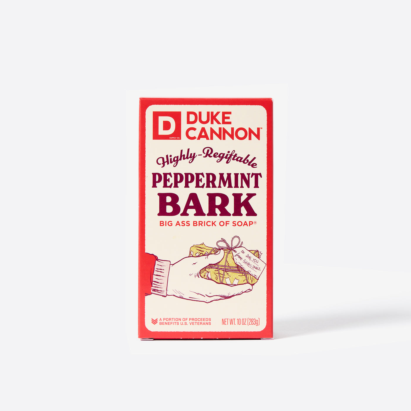 Big Ass Brick of soap inside of its packaging with 'Duke Cannon' branding on a white background. Highly Regiftable Peppermint Bark Ass Big Brick of Soap.