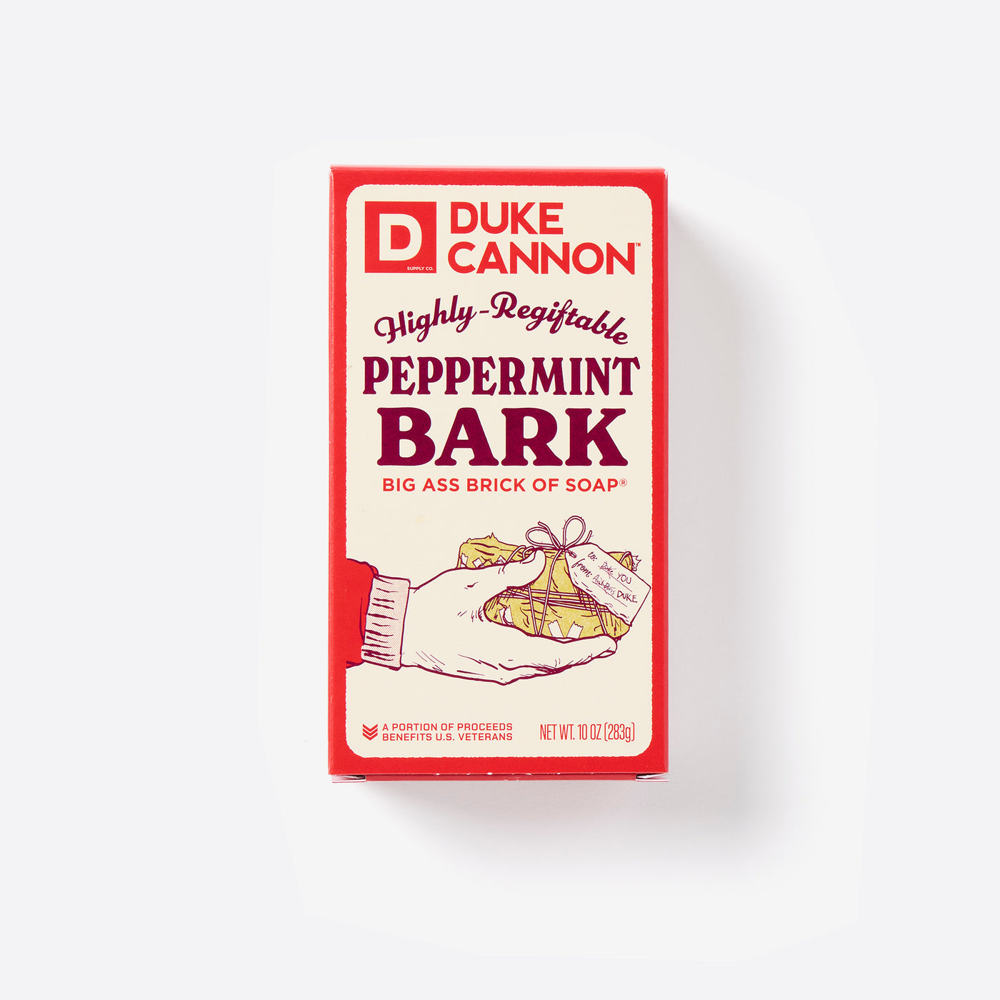 Big Ass Brick of soap inside of its packaging with 'Duke Cannon' branding on a white background. Highly Regiftable Peppermint Bark Ass Big Brick of Soap.