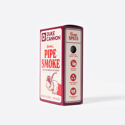 Big Ass Brick of soap inside of its packaging with 'Duke Cannon' branding on a white background. Santa's Pipe Smoke. With the soap specs on the side.