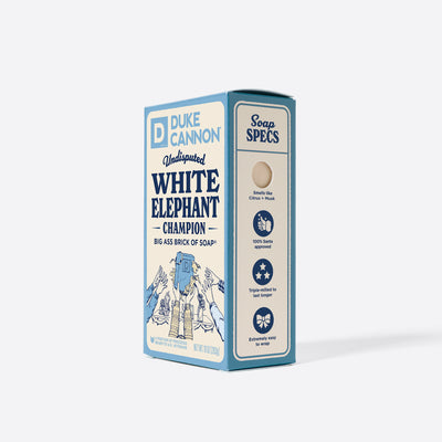 Big Ass Brick of soap inside of its packaging with 'Duke Cannon' branding on a white background. Undisputed White Elephant Champion. With the soap specs on the side.