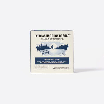 Everlasting Puck of Soap packaging with a scenic illustration on a white background. Everlasting Puck of Soap. Built for Maximum grippability, maneuverability and portability.