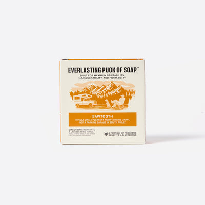 Box of Everlasting Puck of Soap with mountain and camping illustration on a white background. Says: Built for maximum grippability, maneuverability and portability. Smells like a pleasant mountainside jaunt. Not a parking garage in south Philly.