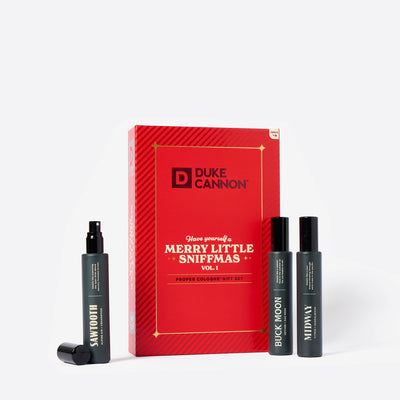 Red Holiday Book cologne gift set called Merry Little Sniffmas Vol. 1. It includes a Buck Moon, Midway and Sawtooth cologne ration.