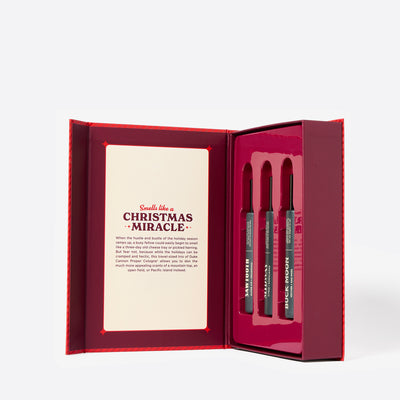 The inside of the Red Holiday Book cologne gift set called Merry Little Sniffmas Vol. 1. It includes a Buck Moon, Midway and Sawtooth cologne ration.