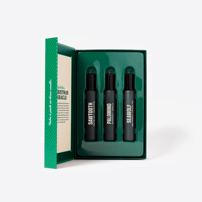 The inside of the Green Holiday Book cologne gift set called Merry Little Sniffmas Vol. 2. It includes a Sawtooth, Palomino and Seawolf cologne ration.