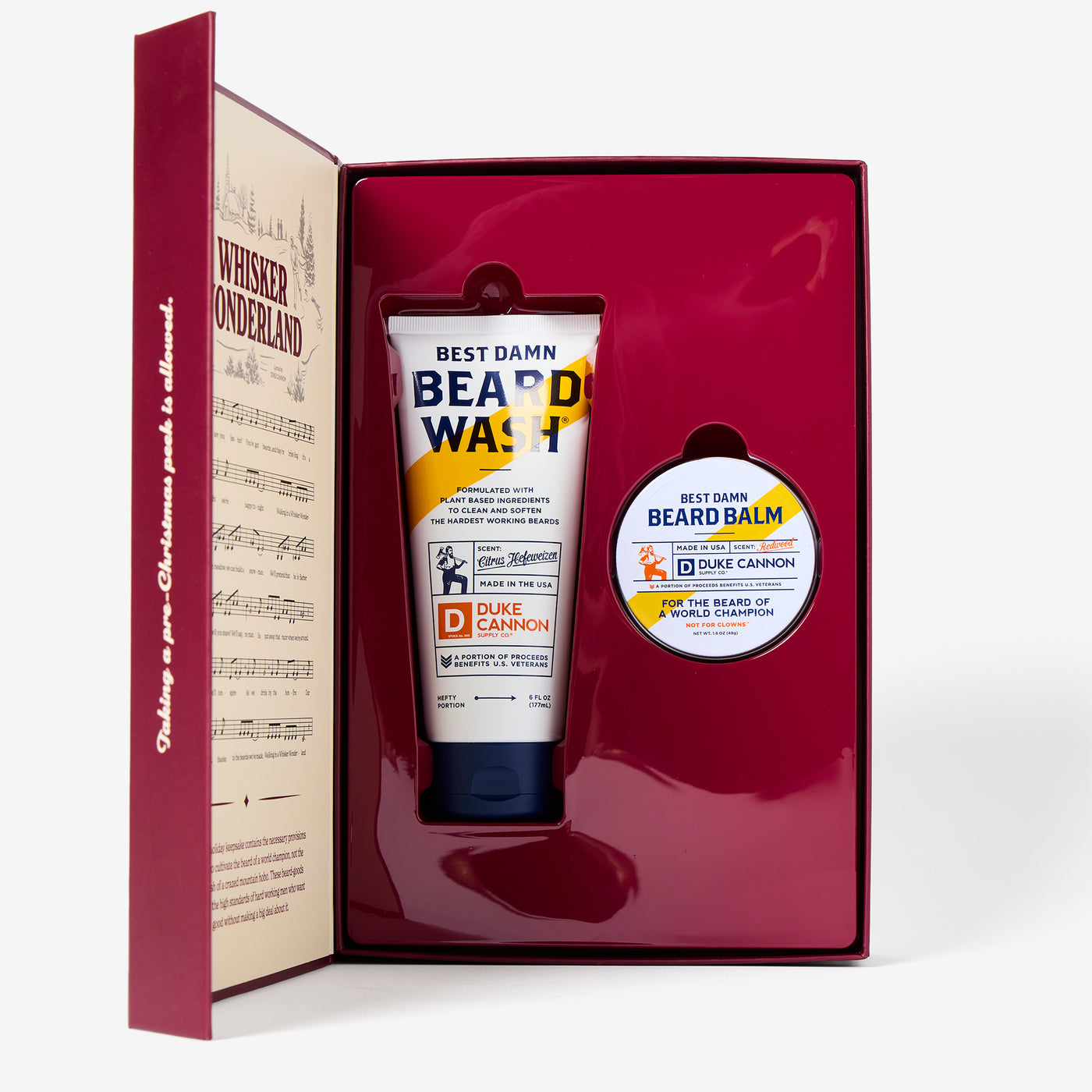 Beard care product set with 'Best Damn Beard Wash' and 'Beard Balm' in a decorative box. The inside of the Whisker Wonderland book.