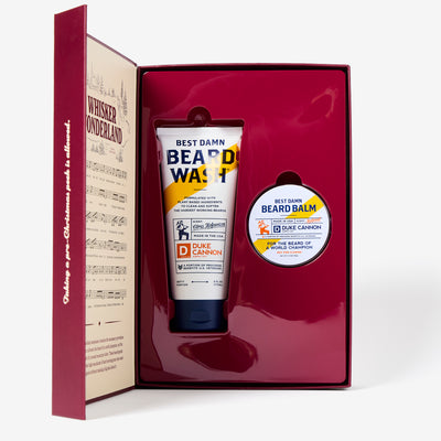 Beard care product set with 'Best Damn Beard Wash' and 'Beard Balm' in a decorative box. The inside of the Whisker Wonderland book.