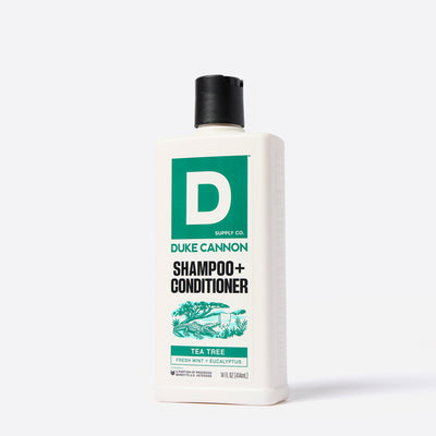 Duke Cannon Tea Tree scented shampoo and conditioner bottle on a white background.  With an illustration of an alligator under a Tea Tree.