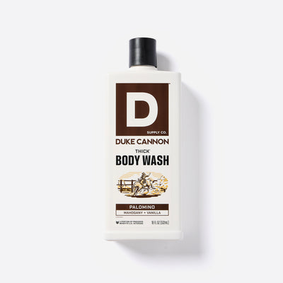 Bottle of Duke Cannon Thick Body Wash in the Palomino Scent on a white background. Palomino - Mahogany + Vanilla scent.