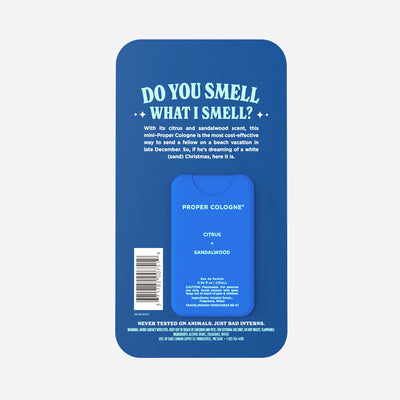The back of the packaging for Scenta's Little Helper travel-size cologne packaging on a white background. The scent is Midway. Smells like Citrus + Sandalwood. Says on the packaging, "Do you smell what I smell?"